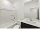 Clean bathroom with a shower-tub combo, modern vanity, and a large mirror at 3337 E Alexander Dr, San Tan Valley, AZ 85143