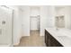 Bathroom featuring double sink vanity, mirror and tile floors with glass door shower at 3337 E Alexander Dr, San Tan Valley, AZ 85143