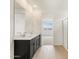 Bathroom featuring double sink vanity, mirror and tile floors with glass door shower at 3337 E Alexander Dr, San Tan Valley, AZ 85143
