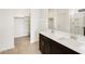 Bathroom featuring double sink vanity, mirror and tile floors with glass door shower at 3337 E Alexander Dr, San Tan Valley, AZ 85143