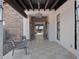 Inviting covered patio featuring tiled floors, elegant lighting, and comfortable seating, offering a tranquil outdoor retreat at 3337 E Alexander Dr, San Tan Valley, AZ 85143
