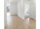 Bright entryway with wood-look tile flooring, showcasing a view into other rooms at 3337 E Alexander Dr, San Tan Valley, AZ 85143