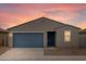 Charming single-story home featuring a two-car garage, desert landscaping, and a welcoming front entrance at 3337 E Alexander Dr, San Tan Valley, AZ 85143