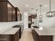 New kitchen featuring stainless steel appliances, granite countertops, and dark wood cabinets at 3337 E Alexander Dr, San Tan Valley, AZ 85143