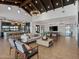 Expansive living room featuring open kitchen, comfortable seating, high ceilings, and modern lighting at 3337 E Alexander Dr, San Tan Valley, AZ 85143