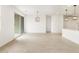 Open-concept space with tile flooring, sliding doors, and modern light fixtures at 3337 E Alexander Dr, San Tan Valley, AZ 85143