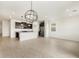 Spacious open-concept space with a kitchen and tile flooring at 3337 E Alexander Dr, San Tan Valley, AZ 85143