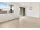 Sunlit room showcasing tile flooring, backyard access, and contemporary lighting at 3337 E Alexander Dr, San Tan Valley, AZ 85143
