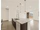 Kitchen island with granite countertop and stainless steel sink at 3353 E Alexander Dr, San Tan Valley, AZ 85143