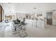Bright, expansive kitchen with modern white cabinets, a large island, and an open dining area at 9175 N 82 St, Scottsdale, AZ 85258