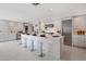 Bright, modern kitchen with white cabinets, stainless steel appliances, and large center island with seating at 9175 N 82 St, Scottsdale, AZ 85258