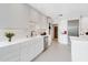 Modern white kitchen featuring sleek cabinets, stainless steel appliances, and stylish backsplash at 9175 N 82 St, Scottsdale, AZ 85258