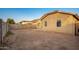 Large backyard with block wall and desert landscaping at 1952 N 103Rd Dr, Avondale, AZ 85392