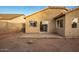 Backyard view showing patio and grassy area at 1952 N 103Rd Dr, Avondale, AZ 85392