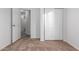 Bright bedroom with neutral carpeting and spacious closet at 1952 N 103Rd Dr, Avondale, AZ 85392