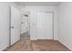 Bedroom with carpet, door to hallway and double door closet at 1952 N 103Rd Dr, Avondale, AZ 85392