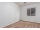 Bright bedroom with carpeted floor and large window at 1952 N 103Rd Dr, Avondale, AZ 85392