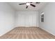 Spacious bedroom with neutral carpeting and double door closet at 1952 N 103Rd Dr, Avondale, AZ 85392