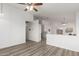 Open dining area with hardwood floors and view of the living room at 1952 N 103Rd Dr, Avondale, AZ 85392
