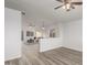 Open floor plan with a half wall separating the living and dining area at 1952 N 103Rd Dr, Avondale, AZ 85392