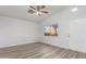 Bright living room with laminate flooring and sliding glass door at 1952 N 103Rd Dr, Avondale, AZ 85392