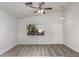 Living room with vinyl flooring and a ceiling fan at 1952 N 103Rd Dr, Avondale, AZ 85392