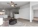 Living room with a view into the kitchen and a coffee table at 1952 N 103Rd Dr, Avondale, AZ 85392