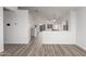 Open concept living area with laminate floors and high ceilings at 1952 N 103Rd Dr, Avondale, AZ 85392