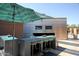 Outdoor kitchen with bar seating and umbrella at 20100 N 78Th Pl # 2143, Scottsdale, AZ 85255