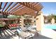 Poolside lounge area with pergola and comfortable seating at 20100 N 78Th Pl # 2143, Scottsdale, AZ 85255