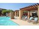 Relaxing pool area with pergola, lounge chairs, and water features at 20100 N 78Th Pl # 2143, Scottsdale, AZ 85255
