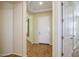 Inviting entryway with neutral walls, wood look flooring, tray ceiling, and white front door at 42086 W Solitare Dr, Maricopa, AZ 85138