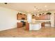 Spacious kitchen with granite counters, center island, stainless appliances, and plenty of cabinet space at 42086 W Solitare Dr, Maricopa, AZ 85138