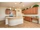 Beautiful kitchen featuring granite countertops, a large island, stainless appliances, and plenty of cabinet space at 42086 W Solitare Dr, Maricopa, AZ 85138