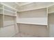 Walk-in closet with multiple shelves and racks, offering ample storage space at 10851 E Le Marche Dr, Scottsdale, AZ 85255