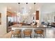 Modern kitchen with granite countertops, stainless steel appliances, and a breakfast bar with seating at 10851 E Le Marche Dr, Scottsdale, AZ 85255