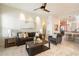 Open-concept living room showcases a comfortable sofa and seamless flow into the modern kitchen at 10851 E Le Marche Dr, Scottsdale, AZ 85255