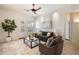 Bright living room with modern furnishings, neutral tones, and access to an outdoor patio at 10851 E Le Marche Dr, Scottsdale, AZ 85255