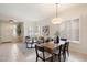 Inviting living room with modern lighting, neutral colors, and open space at 10851 E Le Marche Dr, Scottsdale, AZ 85255