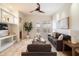 Inviting living room featuring a ceiling fan, leading to the outdoor area with natural light at 10851 E Le Marche Dr, Scottsdale, AZ 85255