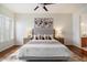 Comfortable main bedroom showcases a ceiling fan, soft lighting, and a relaxing ambiance at 10851 E Le Marche Dr, Scottsdale, AZ 85255