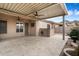 Covered patio with travertine tile, ceiling fans, and mountain views at 10851 E Le Marche Dr, Scottsdale, AZ 85255