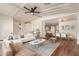 Inviting living room features neutral colors, a modern ceiling fan, and lots of natural light at 11596 W Sierra Dawn Blvd # 157, Surprise, AZ 85378