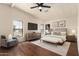 Relaxing main bedroom with a ceiling fan, luxury vinyl floors, and plenty of natural light at 11596 W Sierra Dawn Blvd # 157, Surprise, AZ 85378