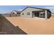 The backyard features ample space with a covered patio, perfect for outdoor relaxation and entertaining at 3649 E Alexander Dr, San Tan Valley, AZ 85143