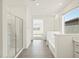 Bright, spacious bathroom featuring a tiled floor, glass shower and vanity with a mirror at 3649 E Alexander Dr, San Tan Valley, AZ 85143