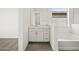 Modern bathroom featuring a vanity with drawers, sink, window, and tile flooring at 3649 E Alexander Dr, San Tan Valley, AZ 85143