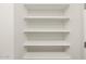 White storage closet with organized, built-in shelving for linen or household items at 3649 E Alexander Dr, San Tan Valley, AZ 85143