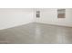 Spacious empty room showing tile flooring and a window at 3649 E Alexander Dr, San Tan Valley, AZ 85143