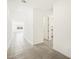 Long hallway with tile flooring and view into open concept space at 3649 E Alexander Dr, San Tan Valley, AZ 85143